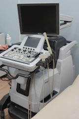 a medical machine with a monitor on top of it