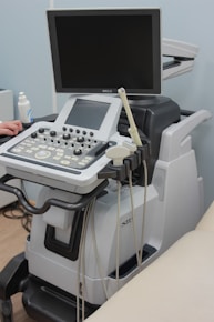 a medical machine with a monitor on top of it