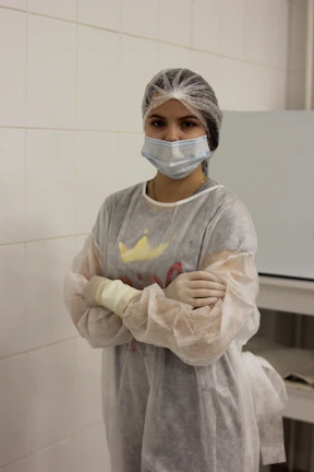 Team member taking environmental samples inside a cleanroom facility.