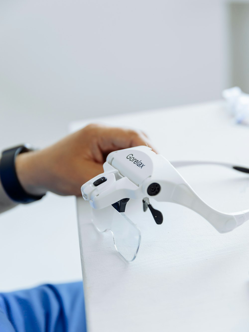 a person using a pair of scissors to cut a piece of paper