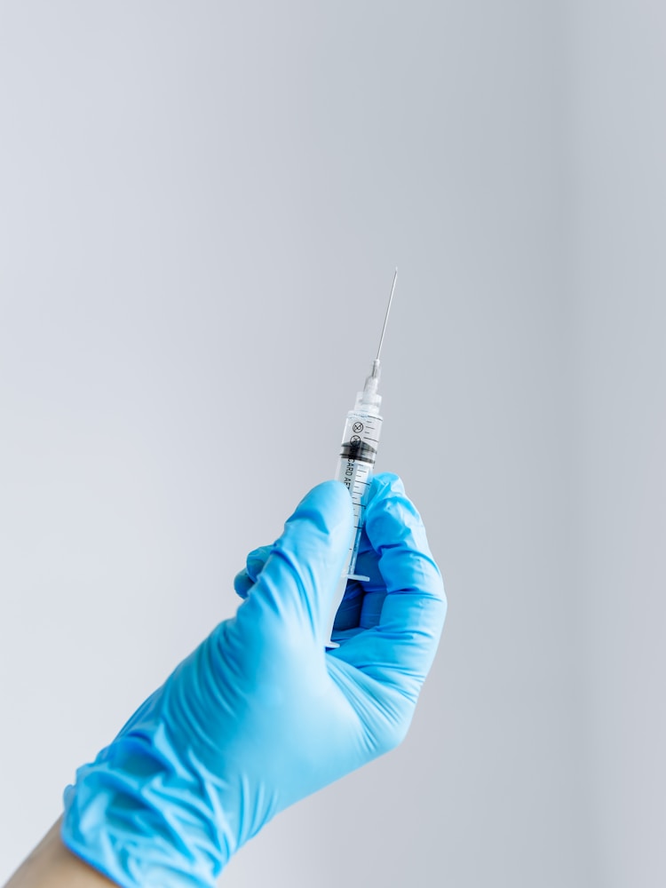 The dengue fever vaccine is given as an injection