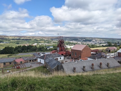 Historic mining heritage site with old machinery and interpretive signs