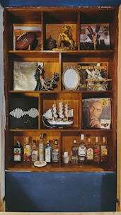 Finished decorative pieces made with laser-cut vinyl displayed on a shelf.