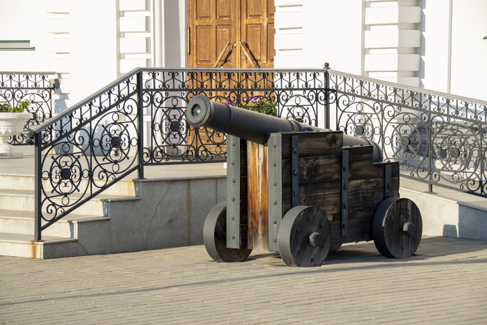 a cannon sitting on top of a wooden cart