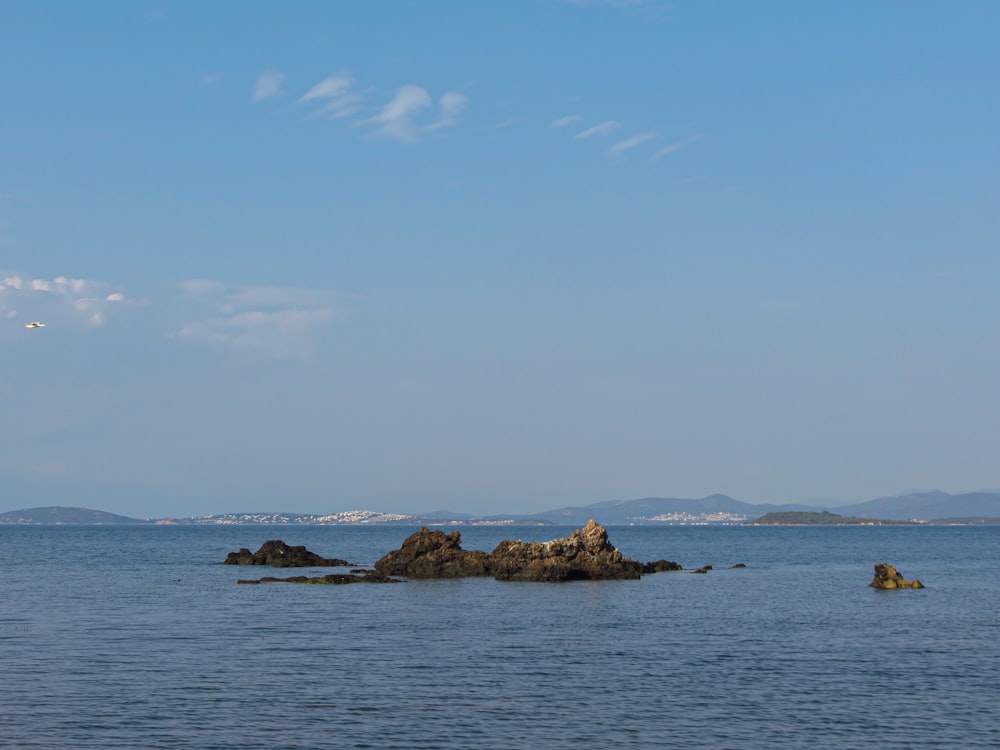 a large body of water with a small island in the middle of it