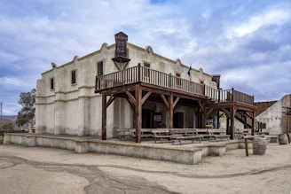 an old building with a wooden balcony and balcony