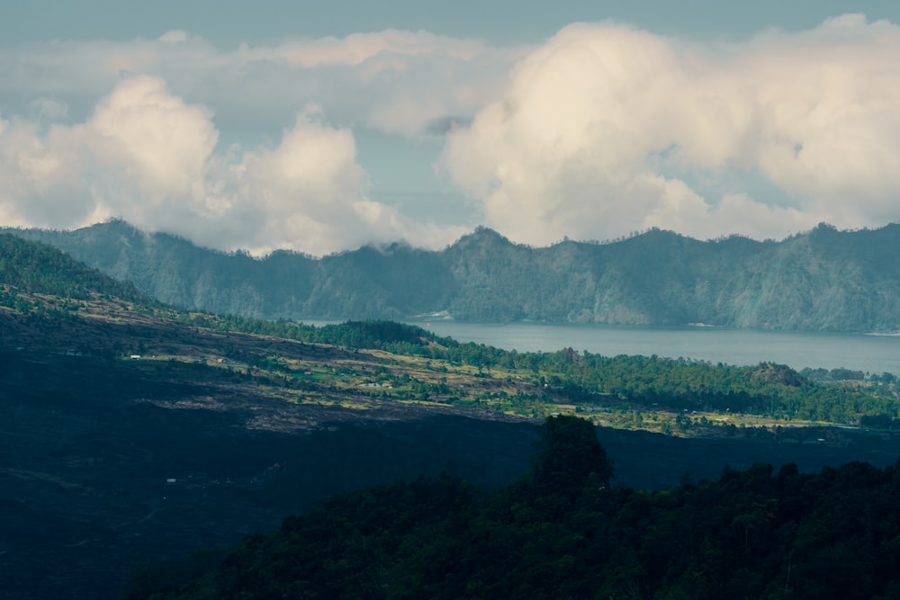 a view of a mountain range with a body of water in the distance