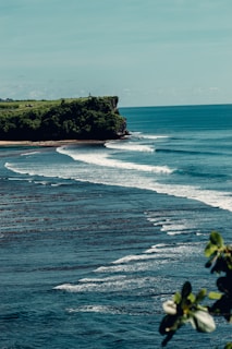a body of water with a small island in the background