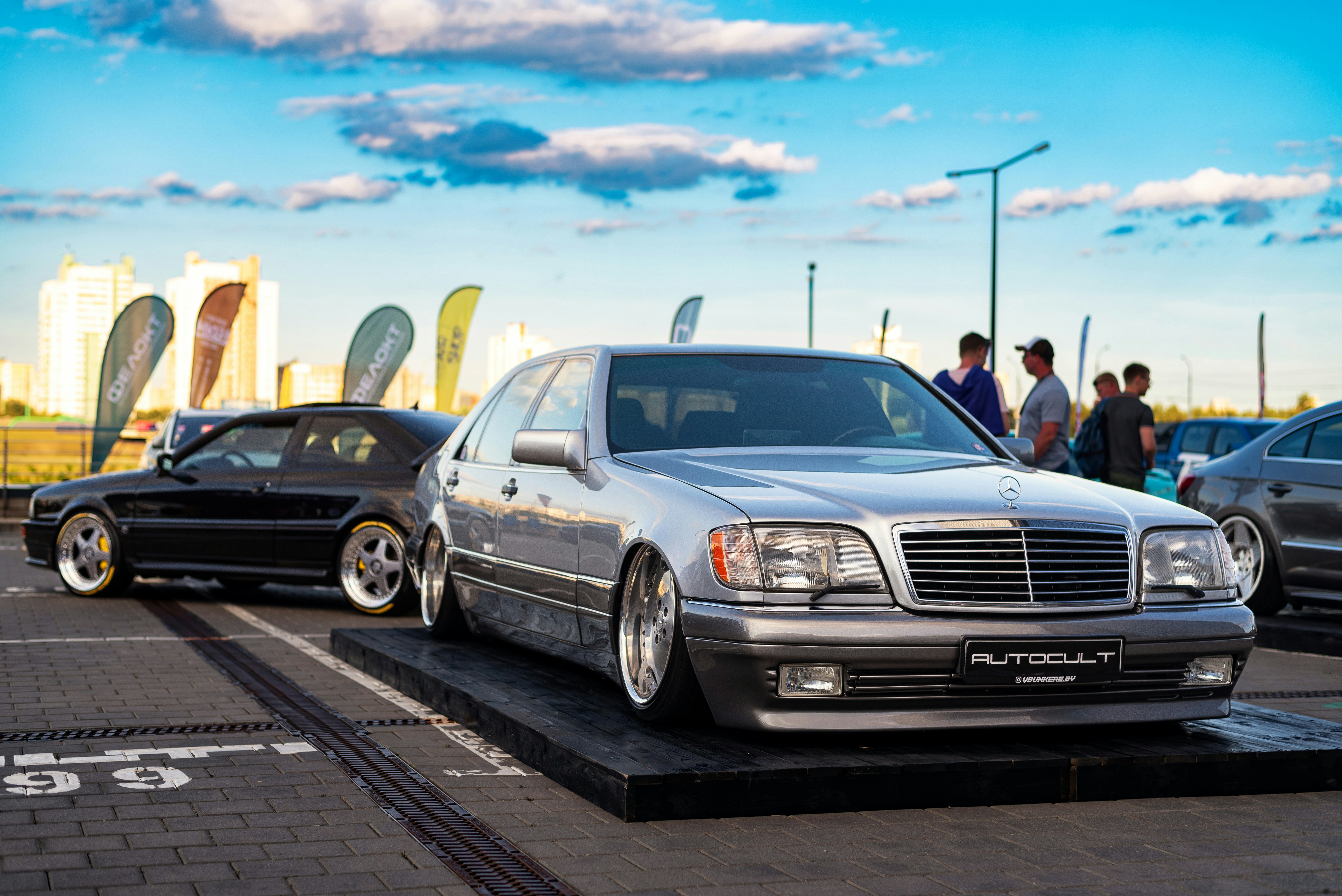 a group of cars parked next to each other in a parking lot