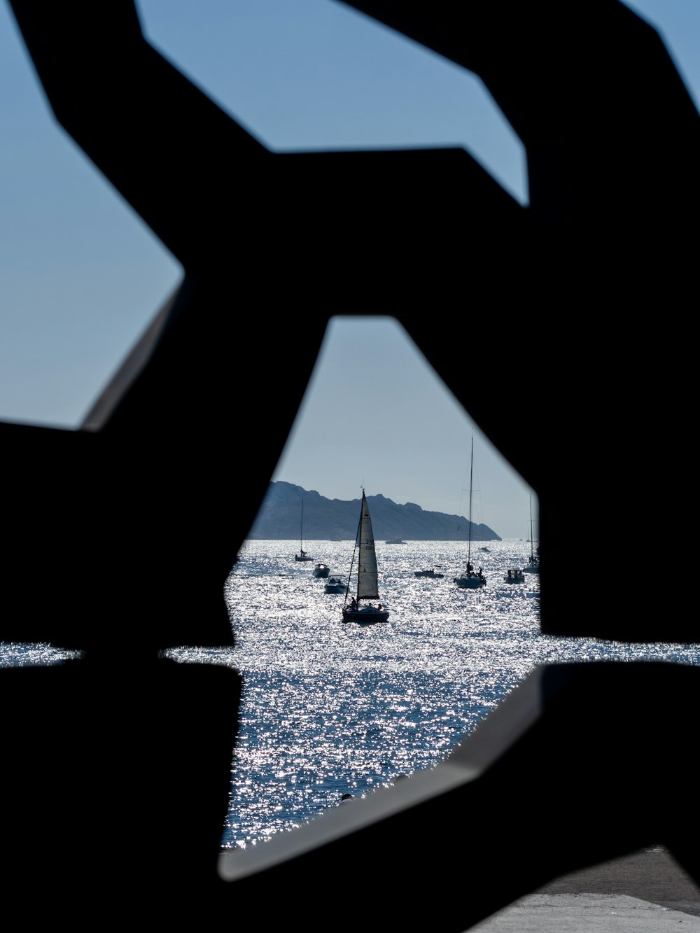 a view of a body of water with boats in the distance