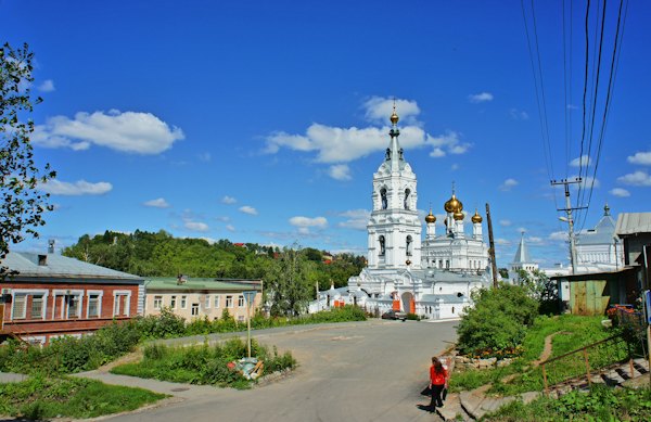 A white church and bell tower above the street — Yaroslavl, Russia