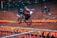 Riders practicing jumps and tricks during a lively weekly session at Ruckstrack.