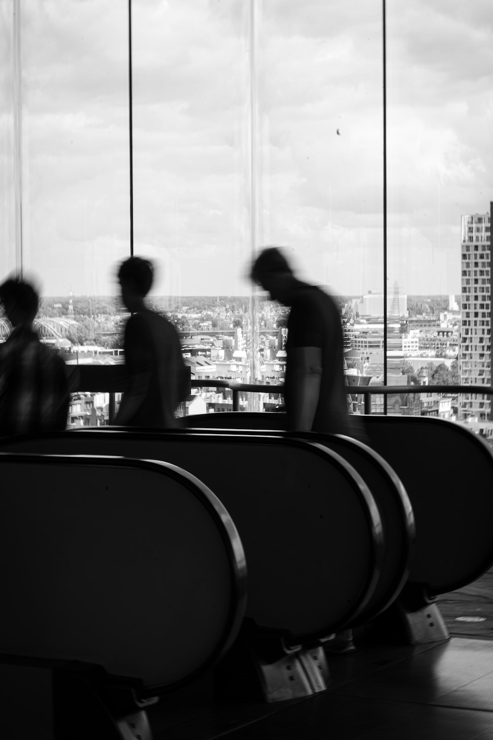 a group of people standing next to each other near a window