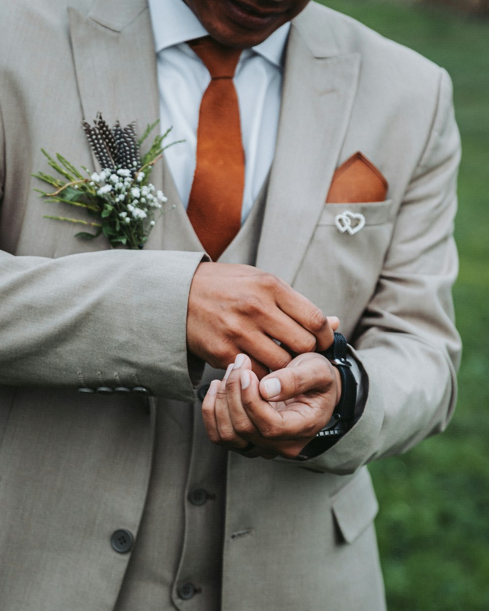 a close up of a person wearing a suit and tie