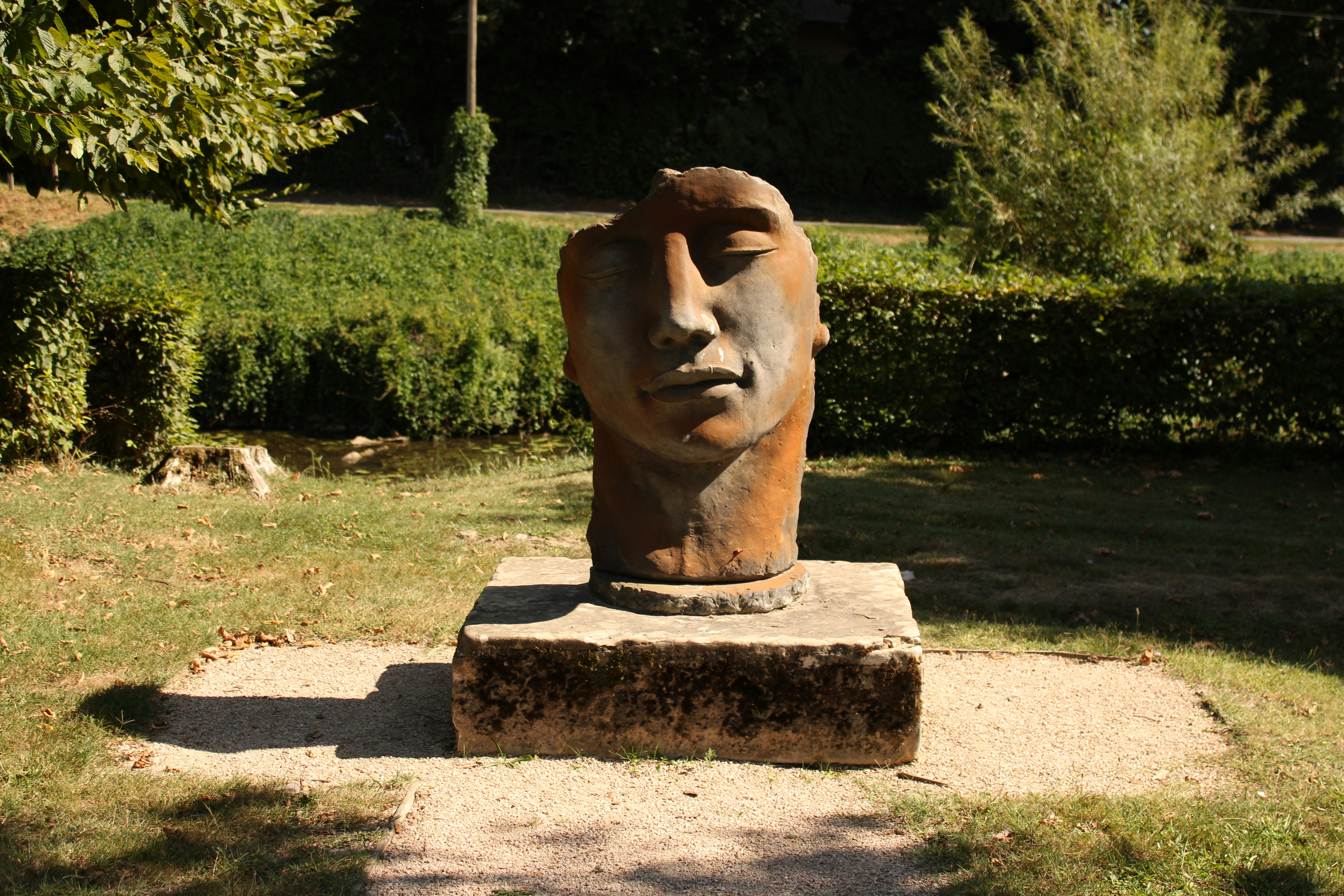 A minimalist modern sculpture on a pedestal.