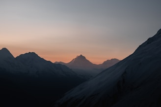 A serene view of the Atlas Mountains at sunset, showcasing the natural beauty of Morocco.