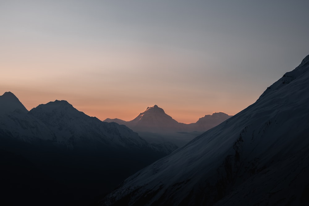 a view of a mountain range at sunset