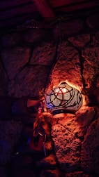 A cozy riad courtyard with traditional Moroccan lanterns glowing warmly.