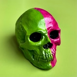 A close-up of a divided face NFT showing a human skull with exposed brain on one side and a glowing alien visage on the other.