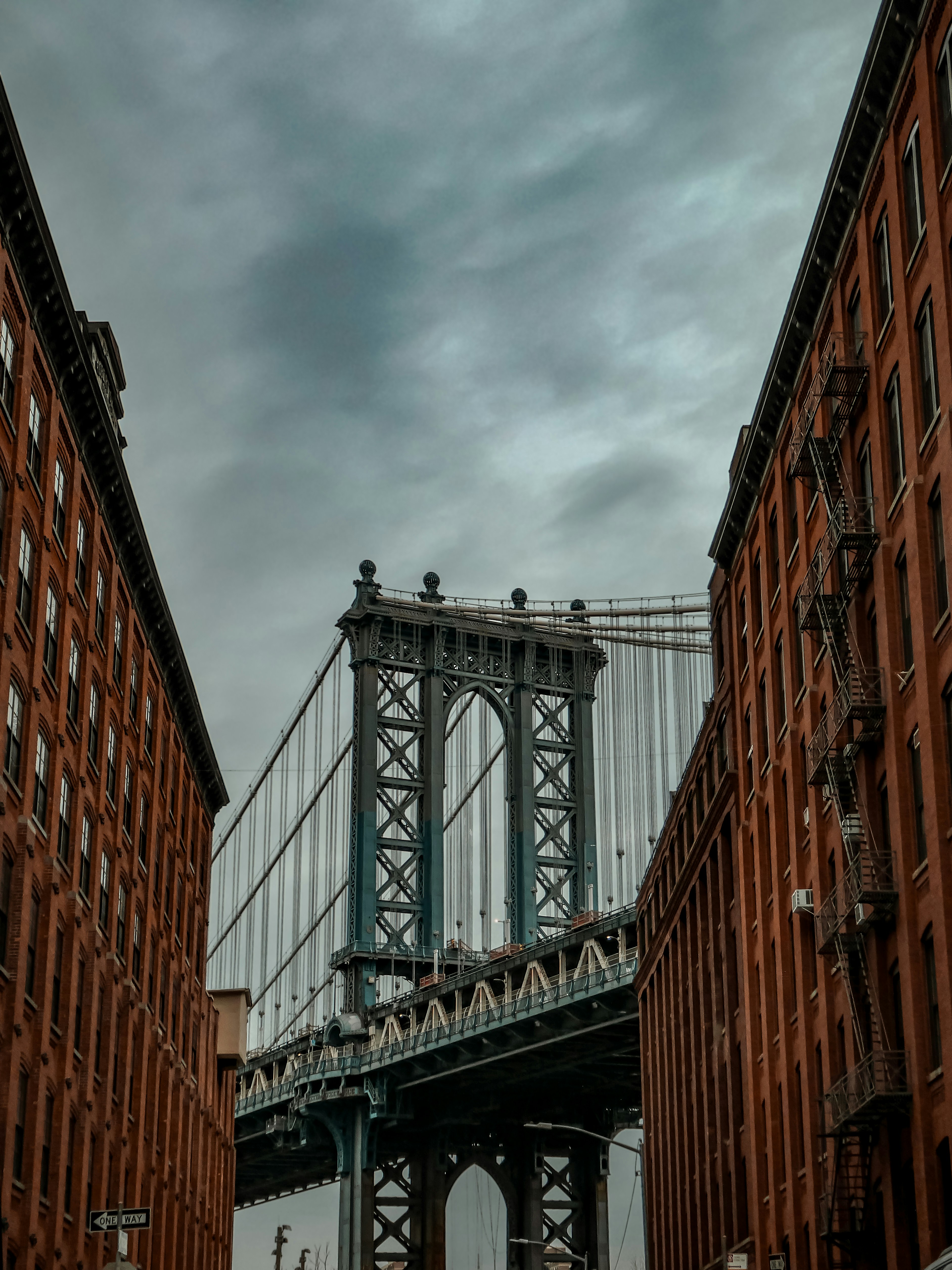 a very tall bridge over some tall buildings