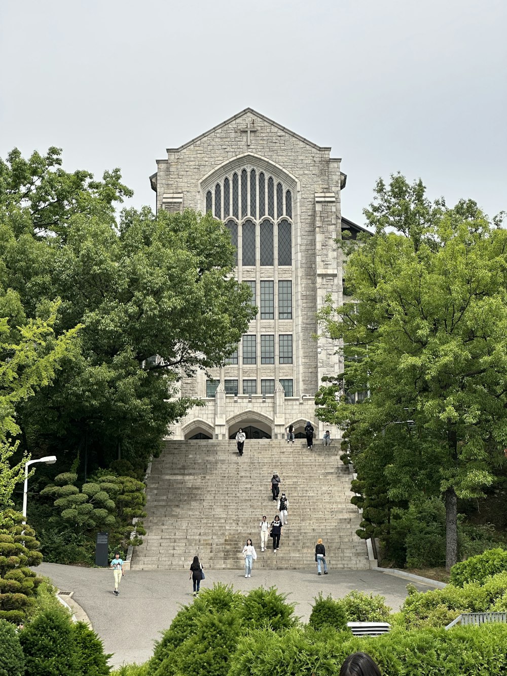 a group of people standing in front of a tall building