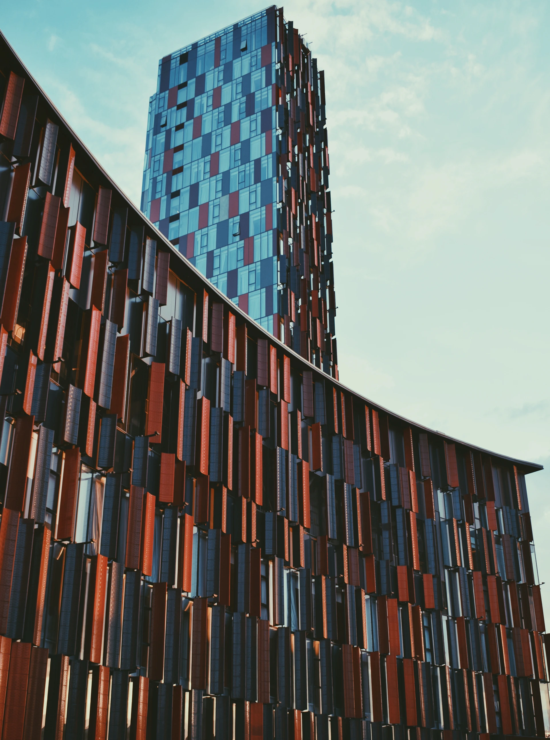 a very tall building with a very tall building in the background