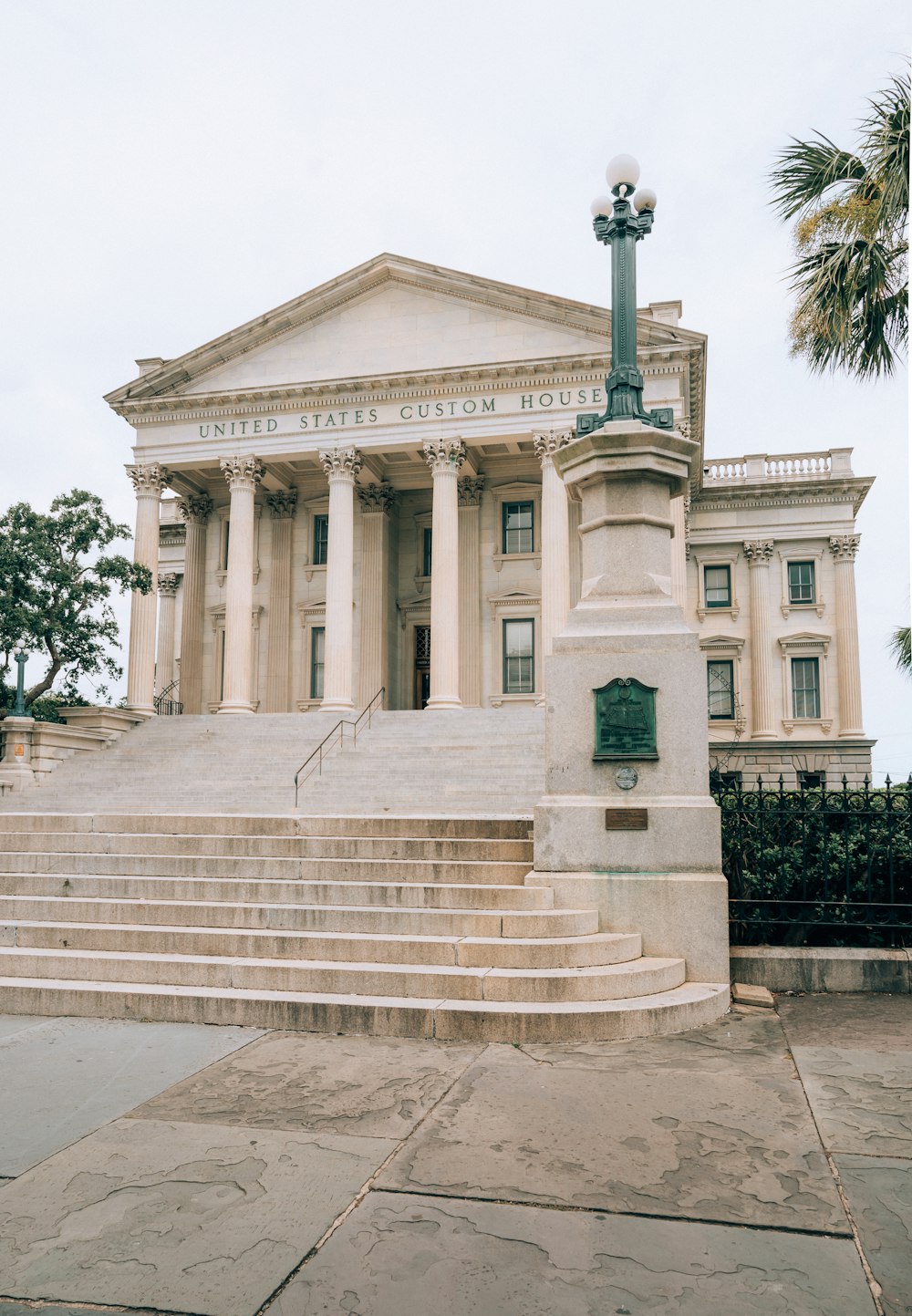 a large white building with columns and steps