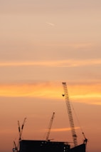 A vibrant aerial shot of a construction site taken by a drone at sunset.
