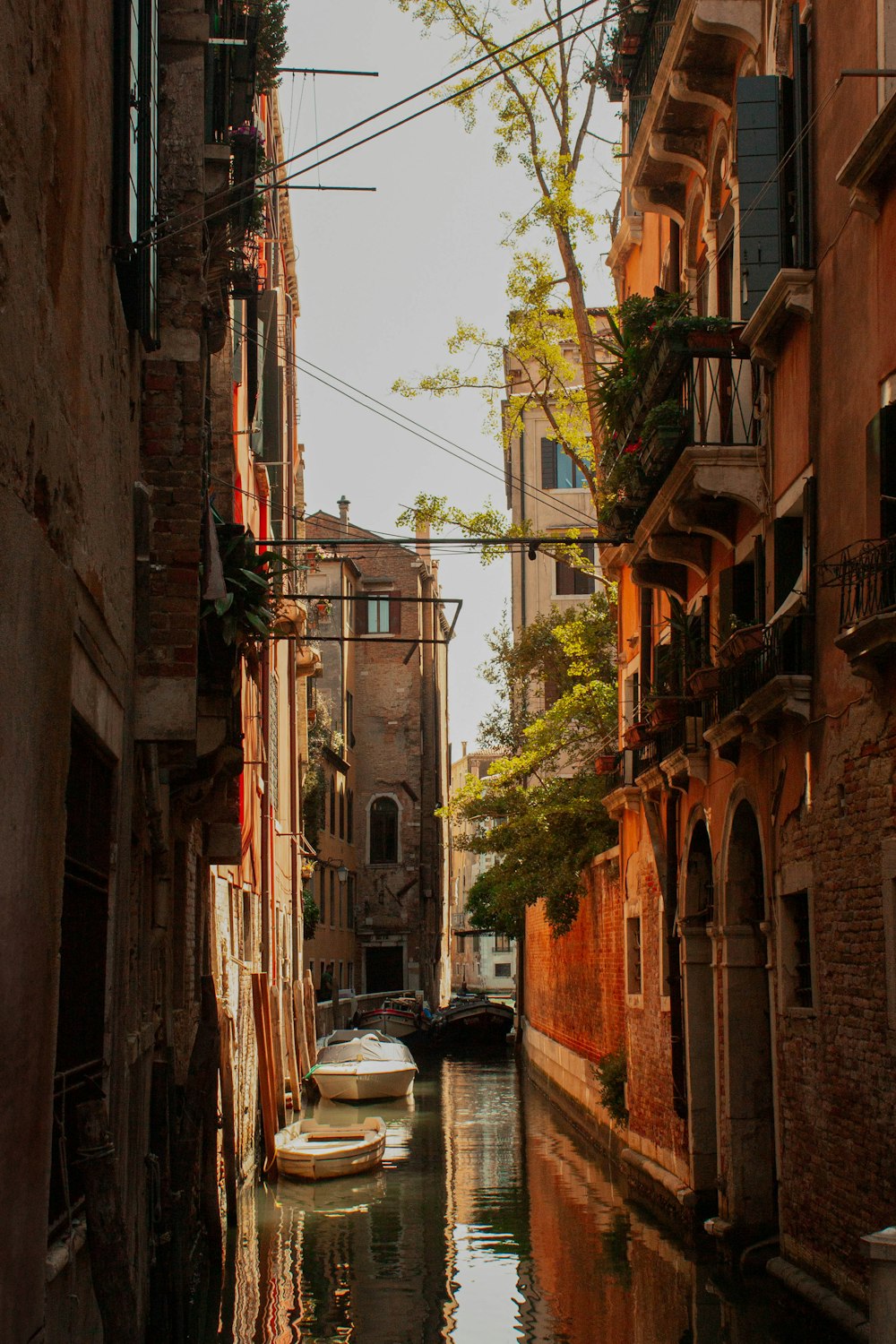 a narrow canal runs between two buildings in a city