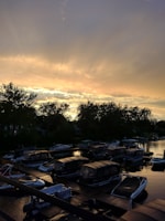 Sunset casting golden hues over boats gently moored at Poonamalie Landing Marina.