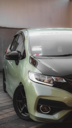A sleek car being detailed with eco-friendly products.