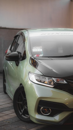 A sleek car being detailed with eco-friendly products.