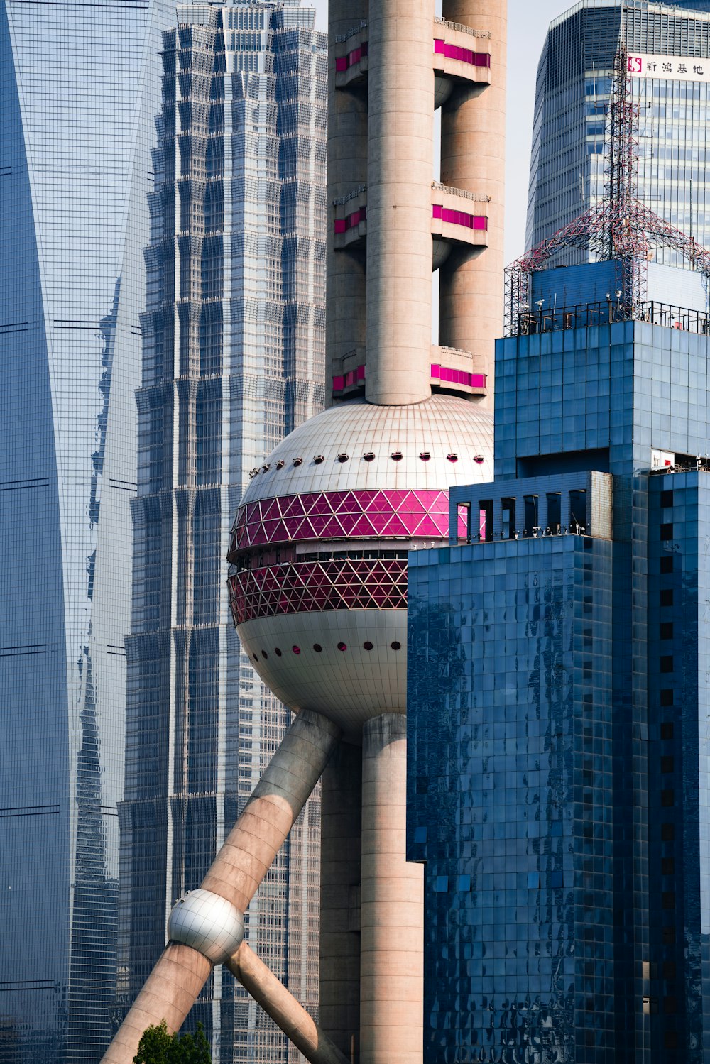 a tall building with a pink dome on top of it