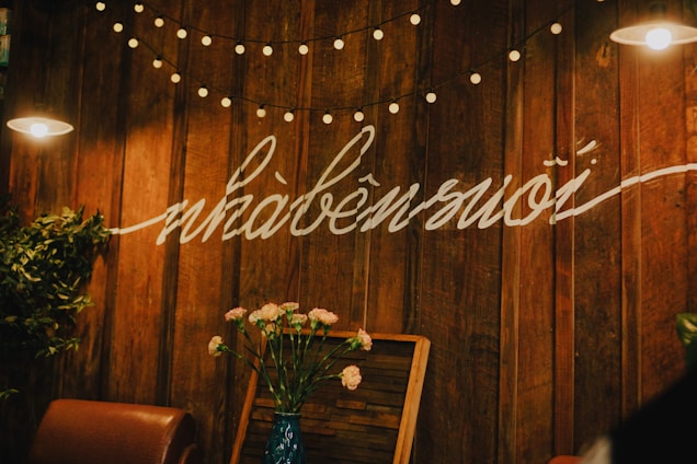 A cozy beauty studio with warm lighting and elegant decor.