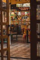 An inviting outdoor patio scene at the Abuja location with guests savoring vibrant dishes.