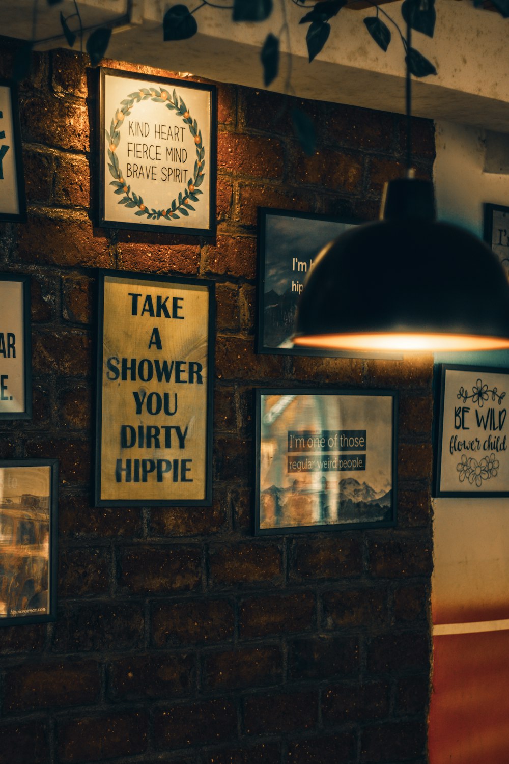 a brick wall with a bunch of signs on it