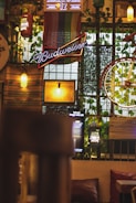 Close-up of decorative elements like plants and vintage signs in a bar.