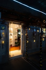 Image of a friendly host meeting guests at a cozy Airbnb entrance.