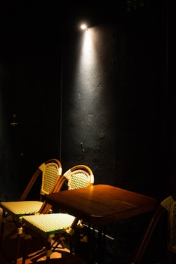 A cozy, softly lit room with two chairs facing each other, inviting conversation and connection.