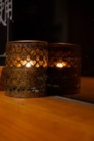 An ornate candle holder casting flickering shadows.