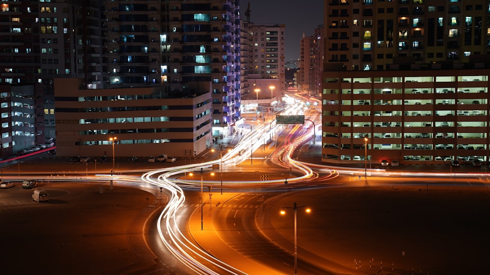 a busy city street at night with a lot of traffic