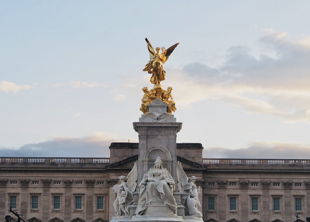 a statue of an angel on top of a building