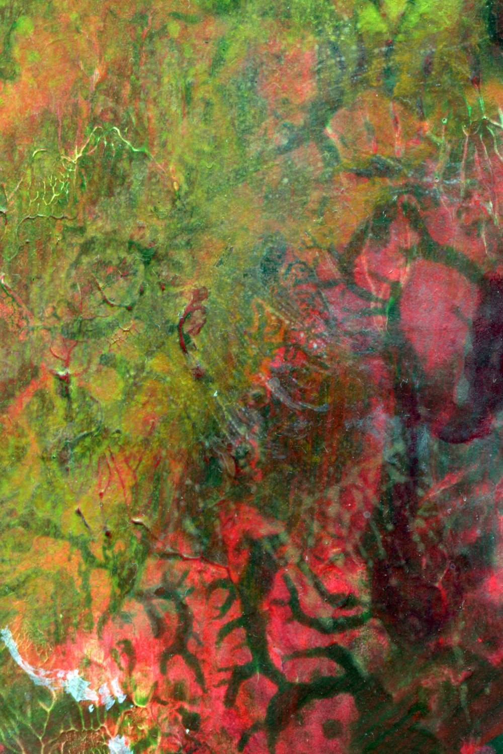 an abstract painting of green and red colors
