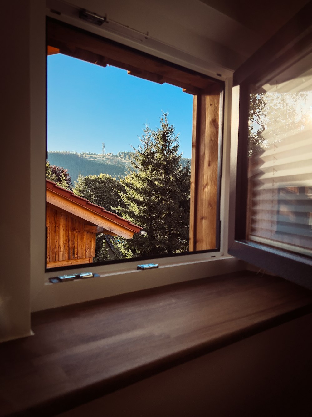 a window with a view of the mountains outside