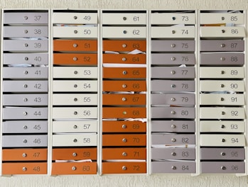 a bunch of mail boxes with numbers on them