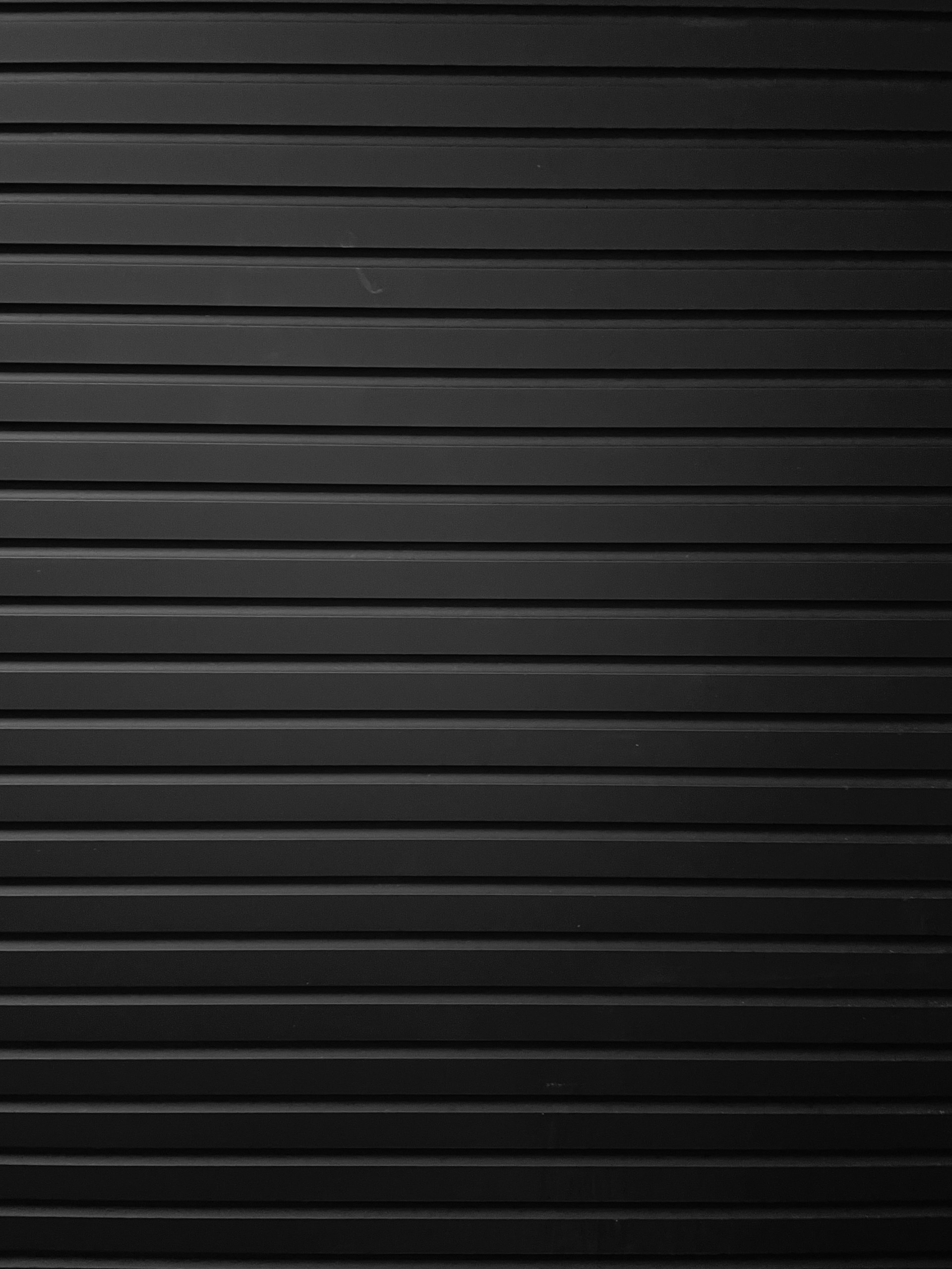 a black and white photo of a wall