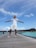 A happy customer standing in front of a beautiful Maldives property.