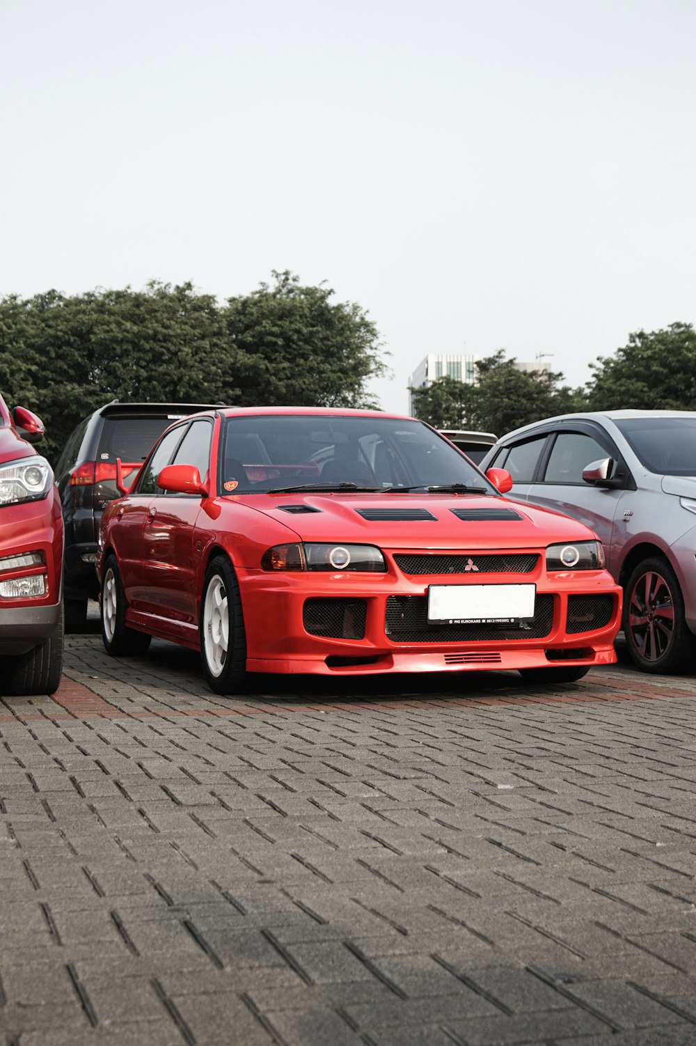 a group of cars parked next to each other