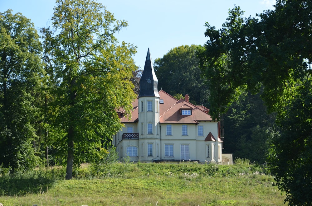 a large white house with a red roof