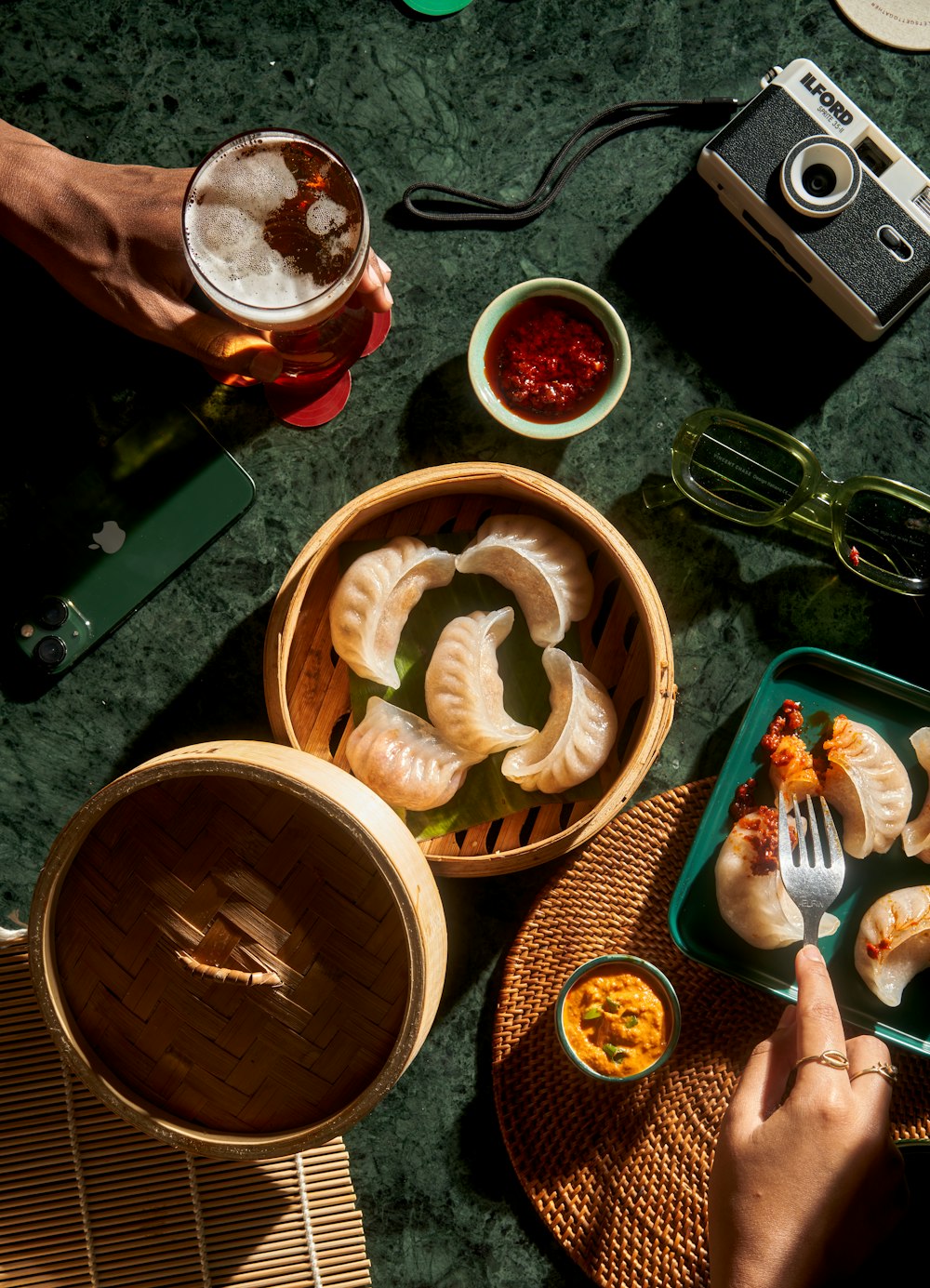 a person is eating dumplings with a fork